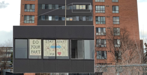 A window sign in an apartment building