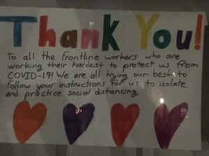 Handwritten sign, with hearts: "Thank you to all the frontline 