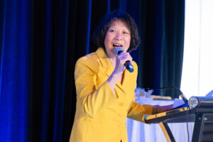Mayor Olivia Chow speaks animatedly into a microphone.